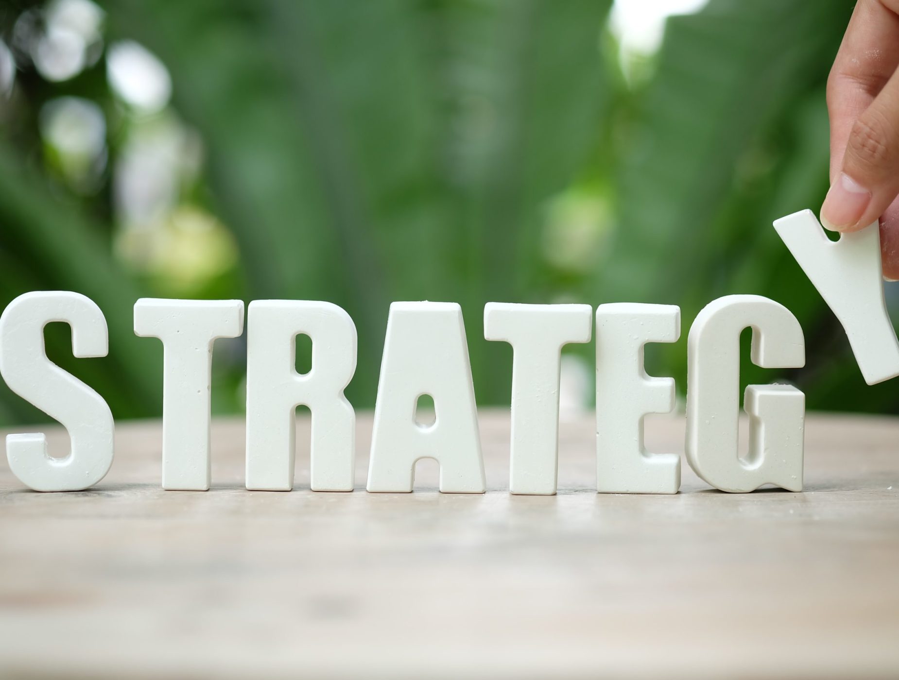 arrange white letters STRATEGY